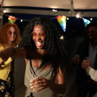 cheerful woman pointing finger and having fun at r 2025 03 08 04 35 16 utc Custom Custom